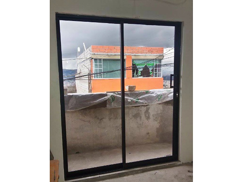 Puerta Corrediza de Doble Hoja Ecuador